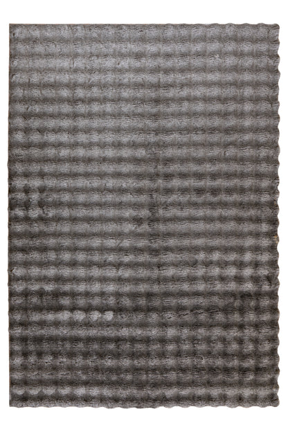 Bovenaanzicht van vloerkleed My Calypso in taupe – luxe structuur en speelse schaduwwerking zichtbaar in de textuur