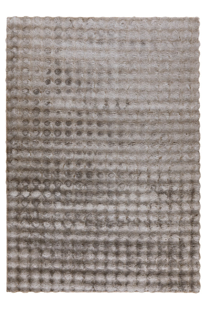 Bovenaanzicht van het beige Lalee Avenue My Calypso vloerkleed met uniek golvend patroon.