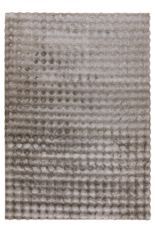 Bovenaanzicht van het beige Lalee Avenue My Calypso vloerkleed met uniek golvend patroon.